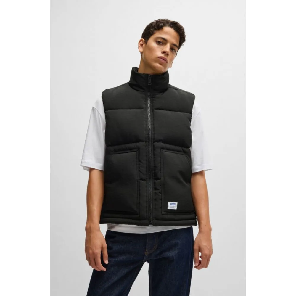 Water-repellent gilet with blue logo label
