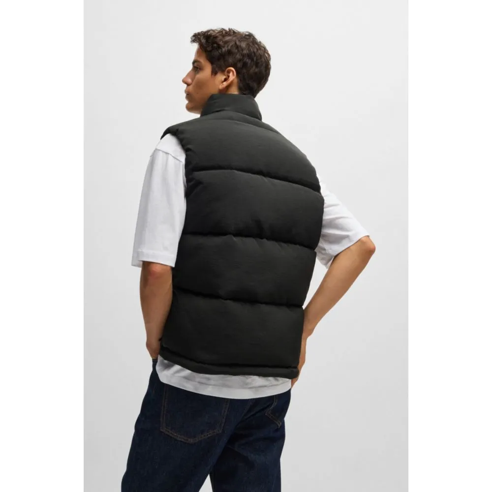 Water-repellent gilet with blue logo label